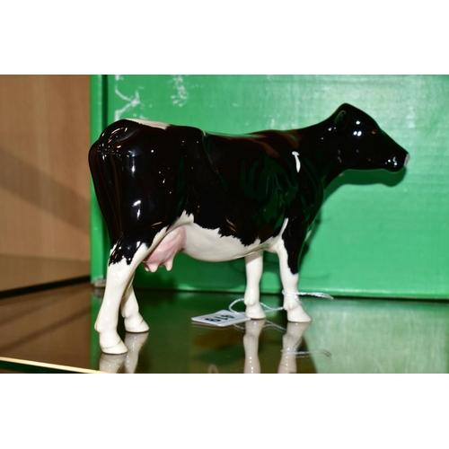 419 - A BOXED BESWICK RARE BREED SHETLAND COW, No 4112 designed b y Robert Donaldson, Beswick crest backst... 