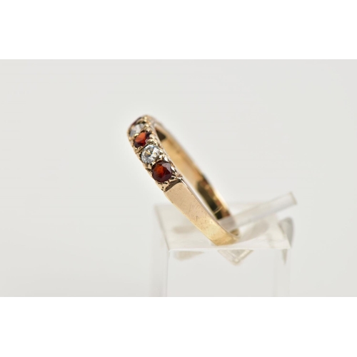 42 - A 9CT GOLD GARNET AND CUBIC ZIRCONIA HALF ETERNITY RING, designed with a row of four circular cut ga... 