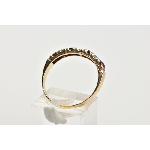 42 - A 9CT GOLD GARNET AND CUBIC ZIRCONIA HALF ETERNITY RING, designed with a row of four circular cut ga... 