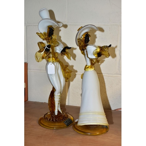 443 - A PAIR OF VENETIAN GLASS COMPANY FIGURES OF A LADY AND GENTLEMAN, white, amber and black, both weari... 