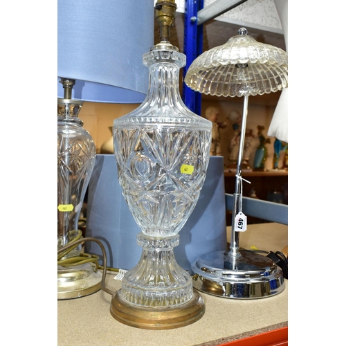 467 - THREE ELECTRIC LAMPS, comprising a cut glass urn shaped table lamp with blue shade, height approxima... 