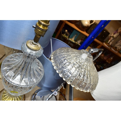 467 - THREE ELECTRIC LAMPS, comprising a cut glass urn shaped table lamp with blue shade, height approxima... 