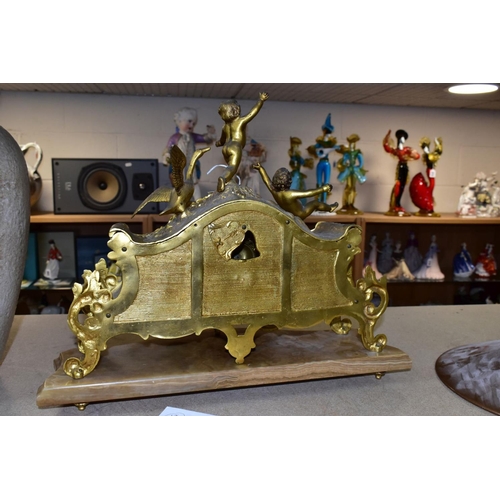 476 - A LATE 19TH CENTURY FRENCH STYLE GILT METAL MANTLE CLOCK, the hand painted dial has a river landscap... 