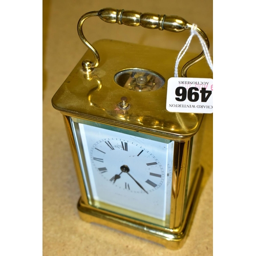 496 - AN EARLY 20TH CENTURY FRENCH BRASS CARRIAGE CLOCK, the rectangular case with small oval panel to the... 