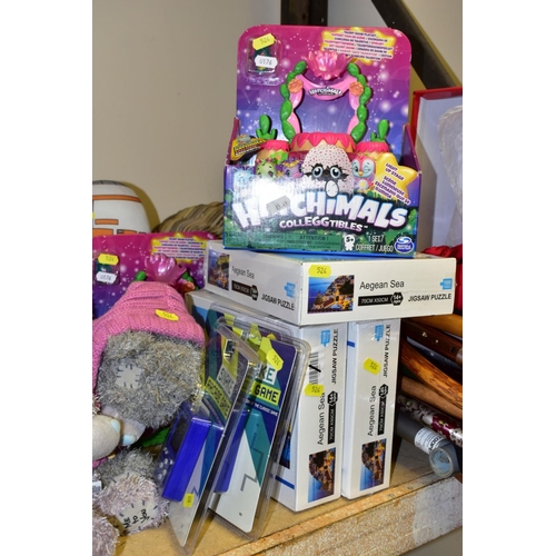 524 - A QUANTITY OF TOYS, SOFT TOYS, JIGSAWS, WALKING STICKS, etc, including a boxed pair of ladies red sa... 