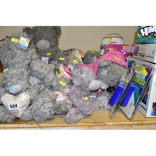 524 - A QUANTITY OF TOYS, SOFT TOYS, JIGSAWS, WALKING STICKS, etc, including a boxed pair of ladies red sa... 