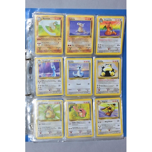 548 - A QUANTITY OF POKEMON CARDS - over four hundred cards of various sets including Base Set, Fossil Set... 