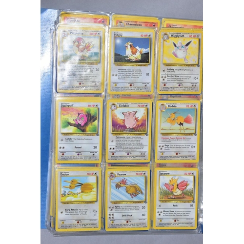 548 - A QUANTITY OF POKEMON CARDS - over four hundred cards of various sets including Base Set, Fossil Set... 