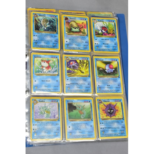 548 - A QUANTITY OF POKEMON CARDS - over four hundred cards of various sets including Base Set, Fossil Set... 