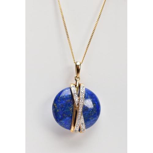 55 - A YELLOW METAL LAPIS LAZULI AND DIAMOND PENDANT NECKLACE AND EARRING GIFT SET, the pendant designed ... 