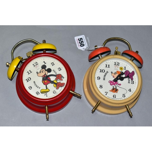 550 - TWO GERMAN MADE MICKEY AND MINNIE MOUSE ALARM CLOCKS, of metal and plastic construction, both appear... 