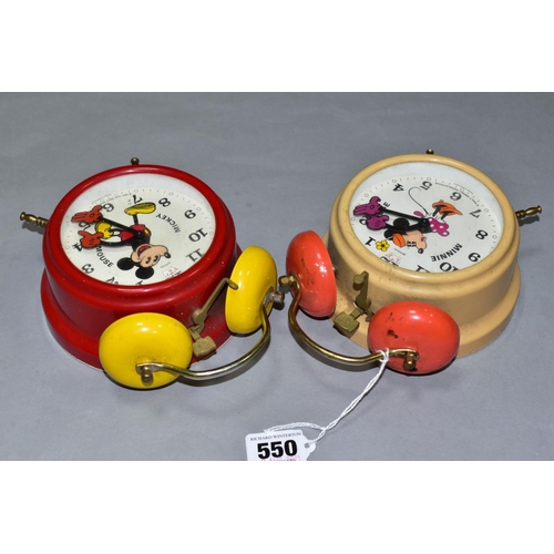 550 - TWO GERMAN MADE MICKEY AND MINNIE MOUSE ALARM CLOCKS, of metal and plastic construction, both appear... 