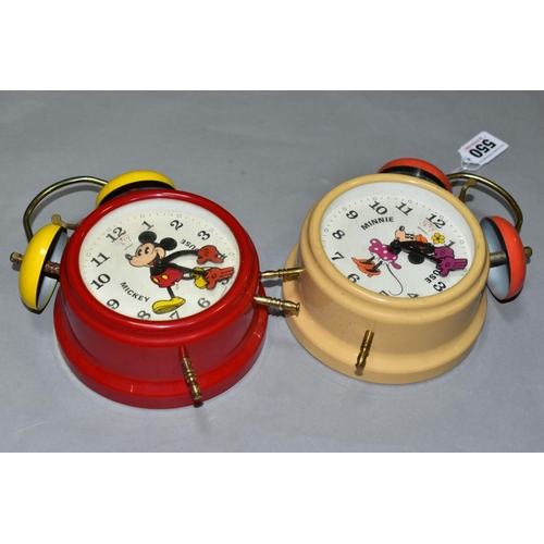 550 - TWO GERMAN MADE MICKEY AND MINNIE MOUSE ALARM CLOCKS, of metal and plastic construction, both appear... 