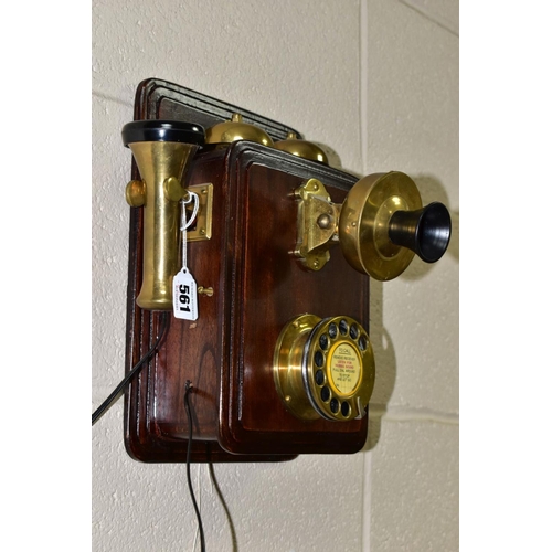 561 - A REPRODUCTION SIEMENS BROTHERS WALL MOUNTED TELEPHONE, wooden body with brass and bakelite fittings... 