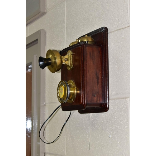 561 - A REPRODUCTION SIEMENS BROTHERS WALL MOUNTED TELEPHONE, wooden body with brass and bakelite fittings... 