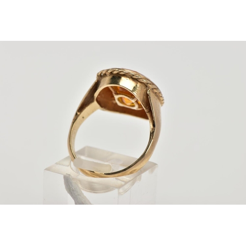 57 - A 9CT GOLD SYNTHETIC ORANGE SAPPHIRE DRESS RING, designed with a large oval cut synthetic orange sap... 