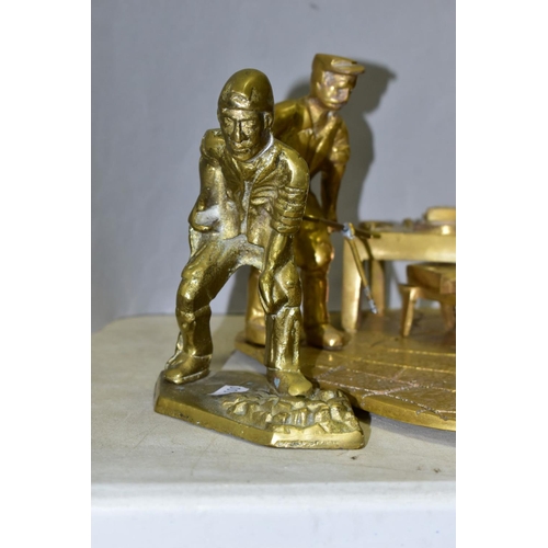 576 - TWO BRASS ORNAMENTS, one depicting coal miner digging (missing shovel), height 15.5cm and a figure g... 