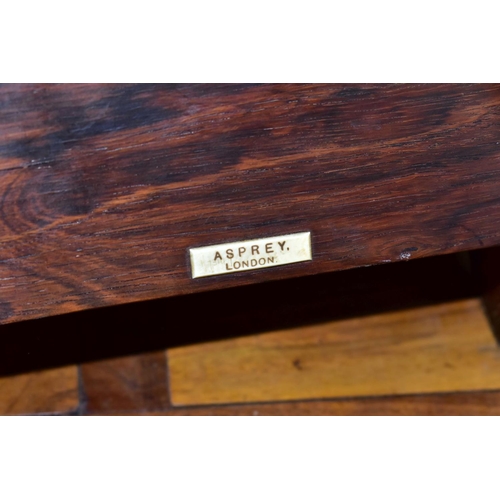 612 - AN EARLY 20TH CENTURY ASPREY TABLE TOP BOOK STAND COMPLETE WITH ASPREY BRANDED BOOKS, of rosewood an... 