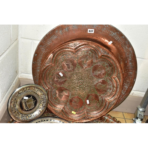 637 - A COLLECTION OF SEVEN INDIAN/MIDDLE EASTERN METAL PLATTERS, CHARGERS AND TRAYS, all either embossed ... 