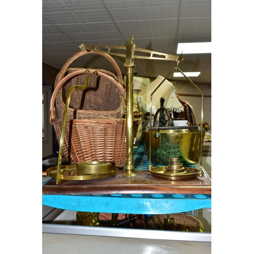 638 - A GROUP OF COPPER, BRASS, WICKER BASKETS, ETC, including a set of balance scales on a mahogany plint... 