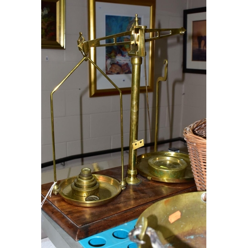 638 - A GROUP OF COPPER, BRASS, WICKER BASKETS, ETC, including a set of balance scales on a mahogany plint... 