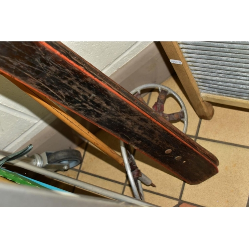 641 - A PAIR OF VINTAGE WOODEN SKIS, with wooden poles and a wooden framed galvanised wash board (2)