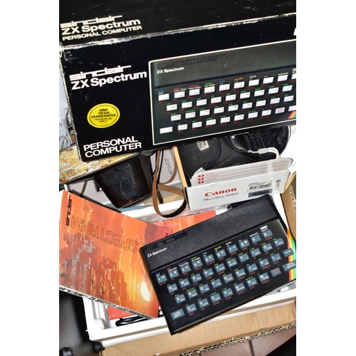 647 - A BOX OF CAMERAS, TECHNOLOGY, etc, including a boxed Sinclair ZX Spectrum, a Crosley portable record... 