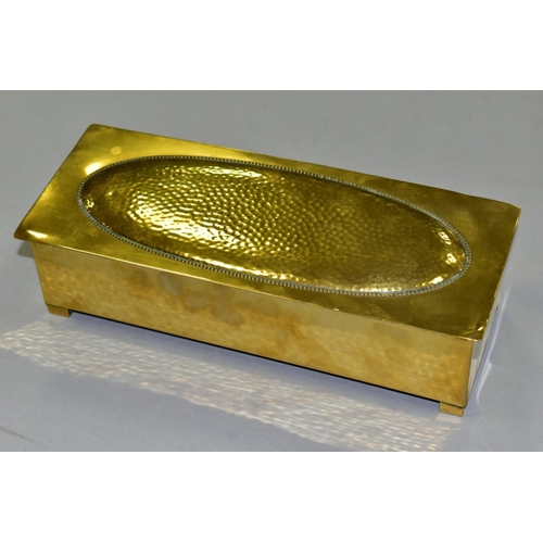 667 - A WMF BRASS AND WOOD CIGARETTE BOX, Circa 1910, the hinged lid has a planished, oval panel, the carc... 