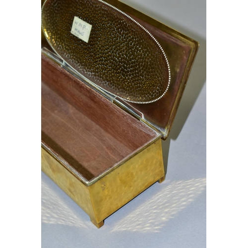 667 - A WMF BRASS AND WOOD CIGARETTE BOX, Circa 1910, the hinged lid has a planished, oval panel, the carc... 