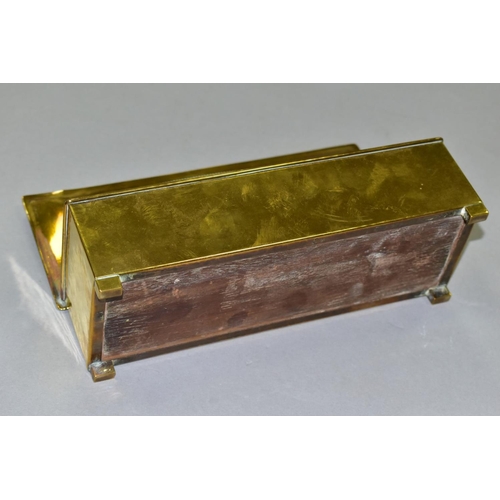 667 - A WMF BRASS AND WOOD CIGARETTE BOX, Circa 1910, the hinged lid has a planished, oval panel, the carc... 