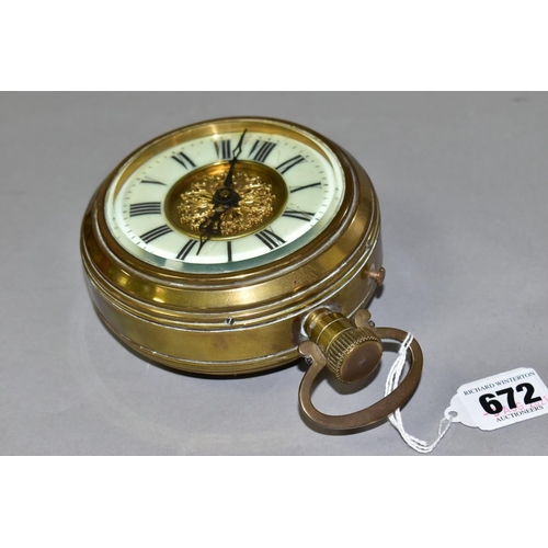 672 - A BRASS CASED DESK CLOCK CIRCA EARLY 20TH CENTURY, in the style of a Goliath pocket watch, the chapt... 