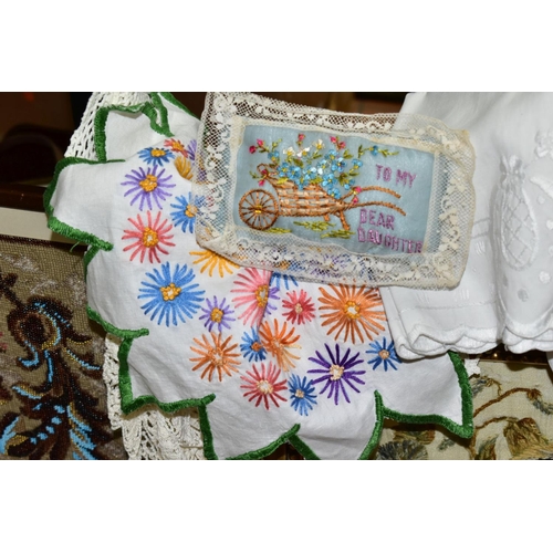 689 - A QUANTITY OF ANTIQUE EMBROIDERED ITEMS to include a framed floral beadwork, crewel work rug, crazy ... 