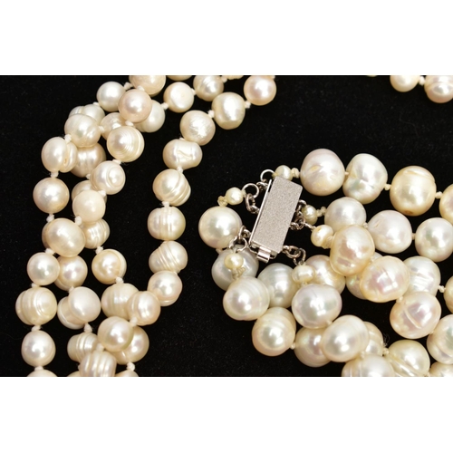 69 - TWO CULTURED FRESH WATER PEARL NECKLACES, to include a three-strand necklace fitted with a white met... 