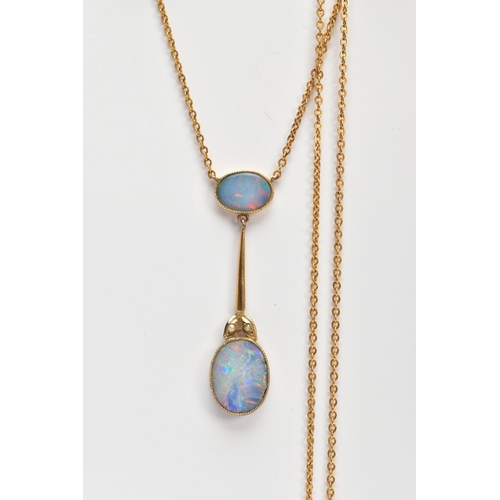 70 - A YELLOW METAL OPAL PENDANT NECKLACE, the pendant designed with an oval cut opal within a milgrain s... 