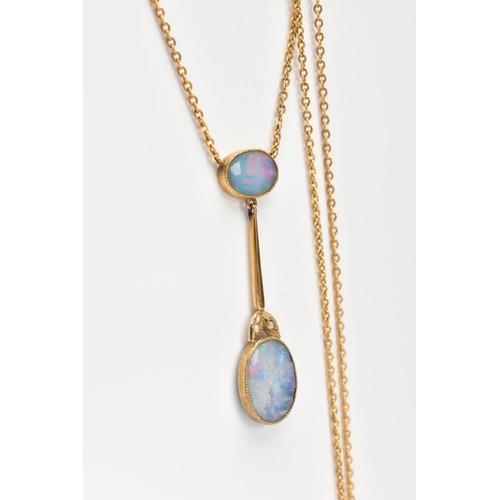 70 - A YELLOW METAL OPAL PENDANT NECKLACE, the pendant designed with an oval cut opal within a milgrain s... 