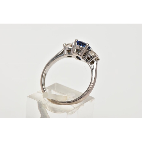 72 - AN 18CT WHITE GOLD SAPPHIRE AND DIAMOND RING, designed with a four-claw set, oval cut blue sapphire,... 