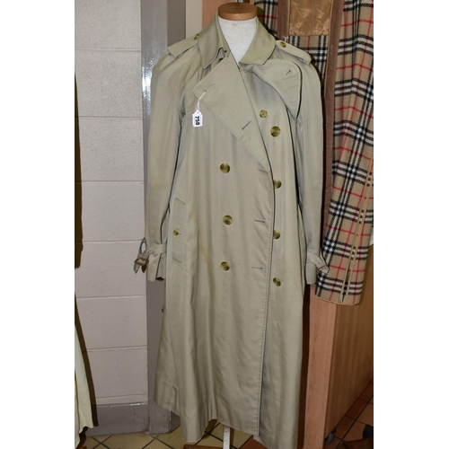 758 - A LADIES BURBERRY TRENCH COAT, with detachable wool lining, approximate size 16/18 (staining to fron... 