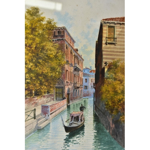 774 - ANDREA BIONDETTI (1851-1946) a Venetian scene of a gondola passing between buildings, signed bottom ... 