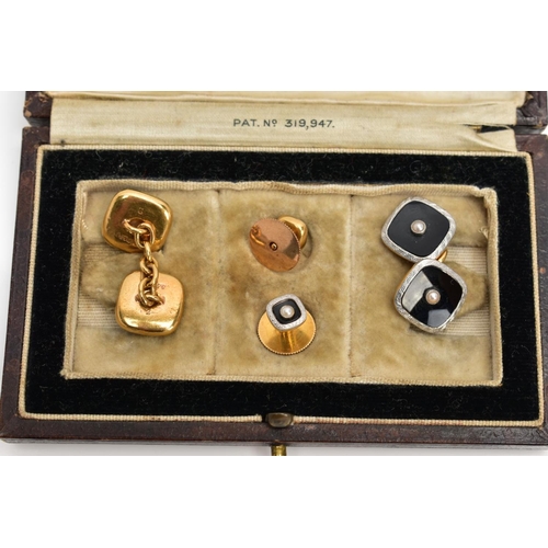 83 - A CASED SET OF EARLY 20TH CENTURY 18CT GOLD AND PLATINUM MOUNTED ONYX AND SPLIT PEARL CUFFLINKS AND ... 