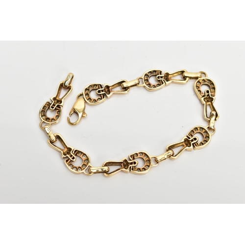 85 - A DIAMOND SET BRACELET, designed as horse shoe shaped links set with round brilliant cut diamonds, e... 