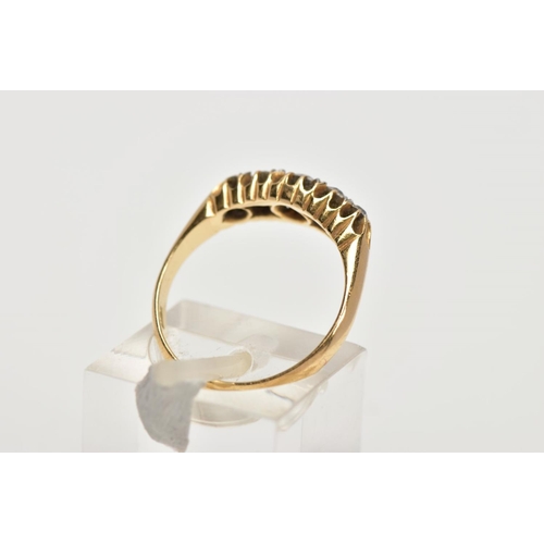 88 - A GOLD LATE VICTORIAN FIVE STONE DIAMOND GRADUATED HALF HOOP RING, diamonds claw set to plain taperi... 