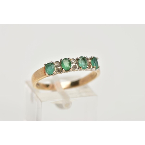 94 - A 9CT GOLD EMERALD AND DIAMOND HALF ETERNITY RING, designed with a row of four claw set oval cut eme... 