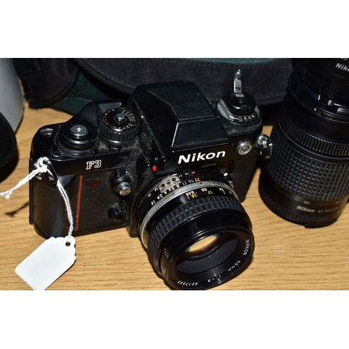 115 - A NIKON F3 FILM CAMERA fitted with a Nikkor 50mm f1.8 lens, a 28mm f3.5 lens, an F100 film camera fi... 