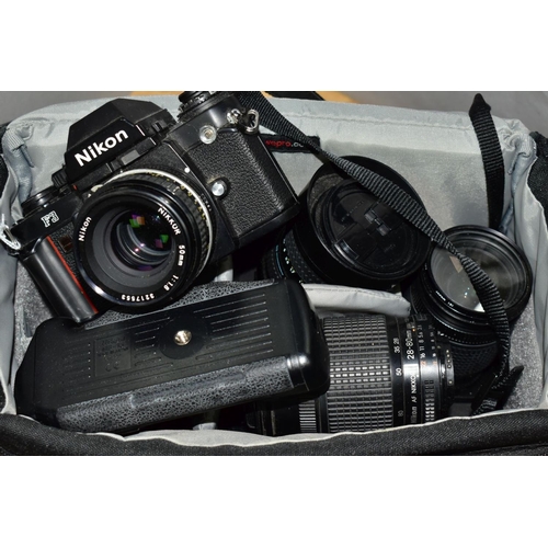 115 - A NIKON F3 FILM CAMERA fitted with a Nikkor 50mm f1.8 lens, a 28mm f3.5 lens, an F100 film camera fi... 