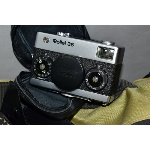 117 - A ROLLEIFLEX SL35E FILM SLR CAMERA fitted with a MC 35mm f2.8 lens, a Rollei 35 film camera, a HFT 5... 