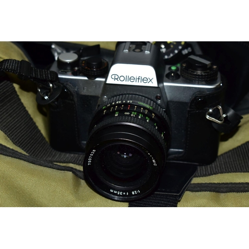 117 - A ROLLEIFLEX SL35E FILM SLR CAMERA fitted with a MC 35mm f2.8 lens, a Rollei 35 film camera, a HFT 5... 