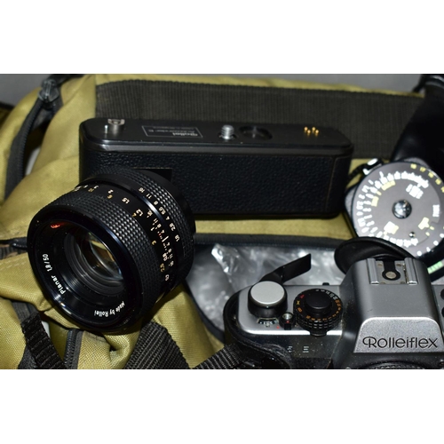 117 - A ROLLEIFLEX SL35E FILM SLR CAMERA fitted with a MC 35mm f2.8 lens, a Rollei 35 film camera, a HFT 5... 