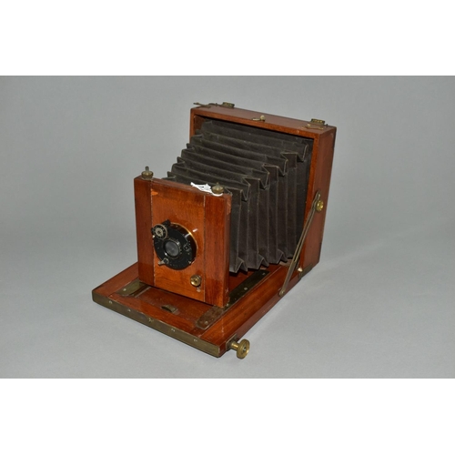 124 - A MAHOGANY AND BRASS CASED 6X8 PLATE CAMERA with a C.P. Goerz, Berlin lens assembly and a Goerz Anas... 