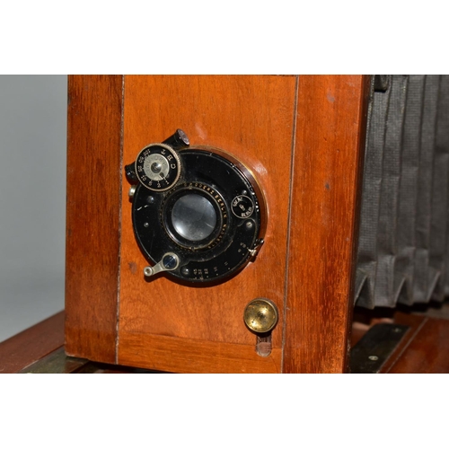 124 - A MAHOGANY AND BRASS CASED 6X8 PLATE CAMERA with a C.P. Goerz, Berlin lens assembly and a Goerz Anas... 