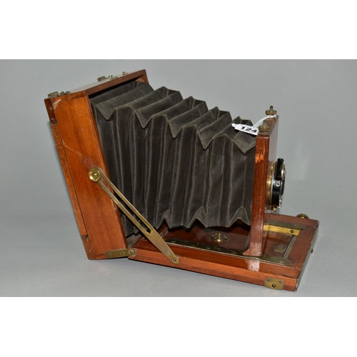 124 - A MAHOGANY AND BRASS CASED 6X8 PLATE CAMERA with a C.P. Goerz, Berlin lens assembly and a Goerz Anas... 